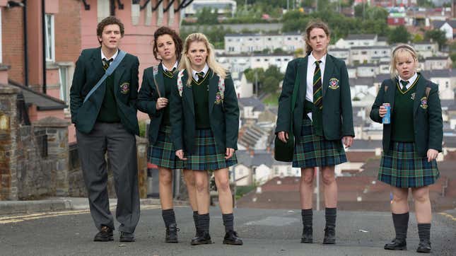 A screenshot of the main teen cast of Derry Girls standing in a street in their school uniforms.