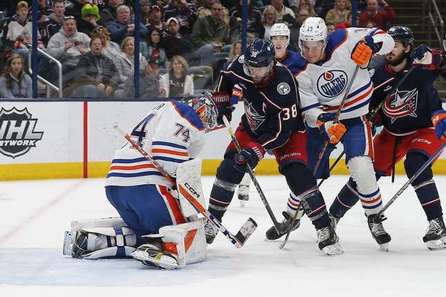 Feb 25, 2023; Columbus, Ohio, USA; Edmonton Oilers goalie Stuart Skinner (74) makes a save as Columbus Blue Jackets center Boone Jenner (38) looks for a rebound during the second period at Nationwide Arena.