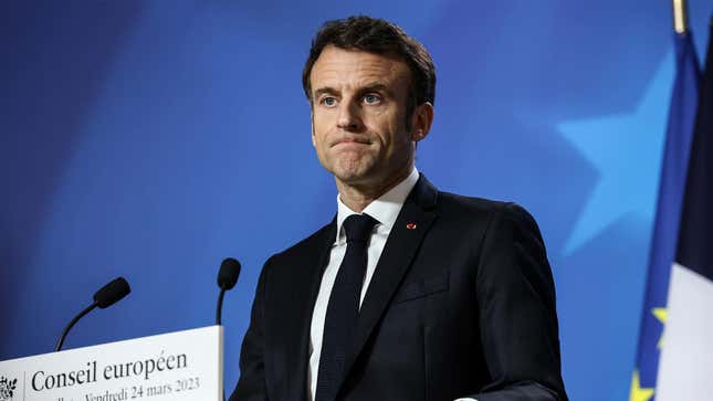French president Emmanuel Macron standing at a podium during a news conference at the European Union leaders summit.