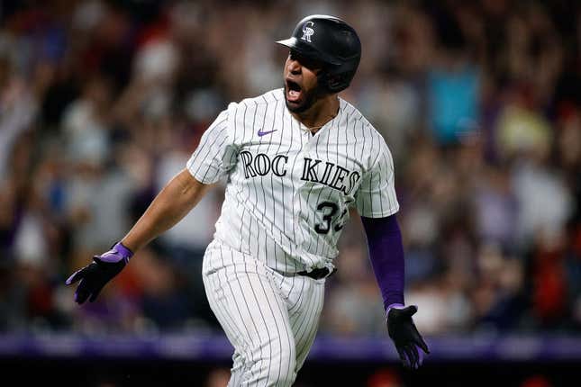Jun 23, 2023; Denver, Colorado, USA; Colorado Rockies catcher Elias Diaz (35) reacts after hitting a grand slam in the eighth inning against the Los Angeles Angels at Coors Field.