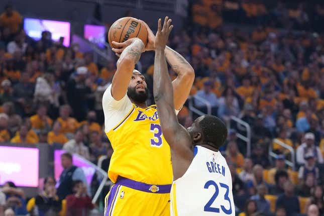 May 10, 2023; San Francisco, California, USA; Los Angeles Lakers forward Anthony Davis (3) shoots the basketball against Golden State Warriors forward Draymond Green (23) during the first quarter in game five of the 2023 NBA playoffs conference semifinals round at Chase Center.