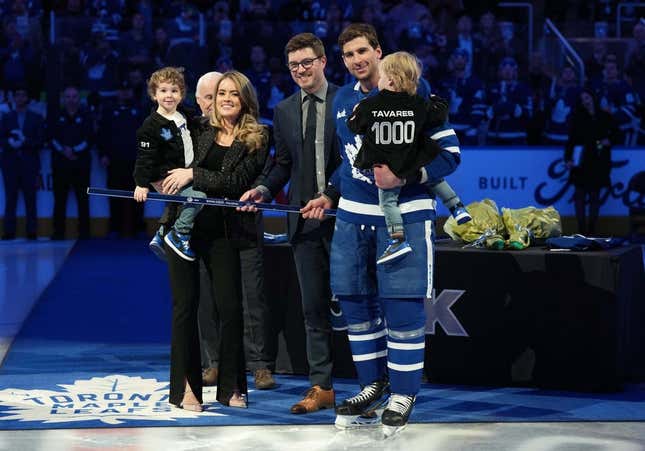 Jan 29, 2023; Toronto, Ontario, CAN; Toronto Maple Leafs center John Tavares (91) receives a commemorative hockey stick from Toronto Maple Leafs General Manager Kyle Dubas for his1000th NHL game ceremony against the Washington Capitals at Scotiabank Arena.
