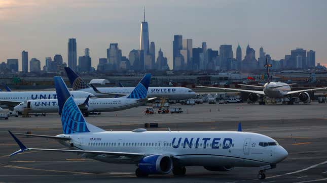 A United Airlines airplane makes its way to a gate in front of the skyline of lower Manhattan in New York City at Newark Liberty Airport on April 8, 2023, in Newark, New Jersey. 