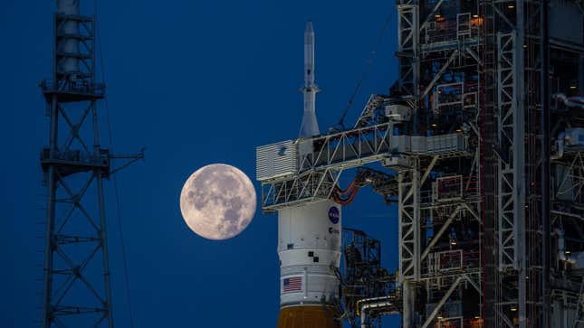 The Orion capsule atop SLS, with the full Moon in the background. 