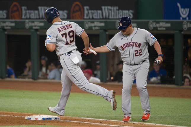 Sep 6, 2023; Arlington, Texas, USA; Houston Astros first baseman Jose Abreu (79) rounds first base past first base coach Omar L pez (22) after Abreu hits a grand slam home run against the Texas Rangers during the third inning at Globe Life Field.