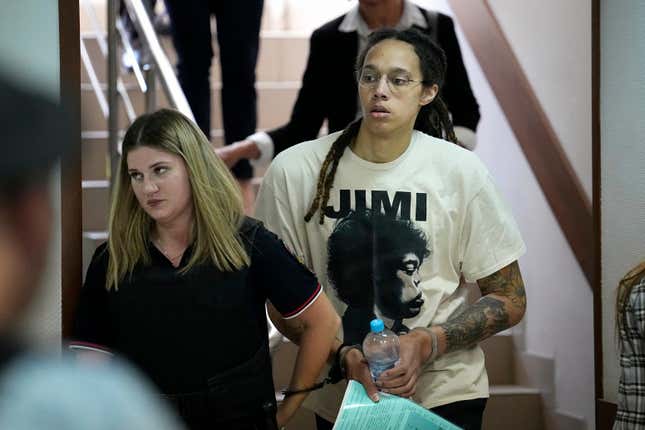 WNBA star and two-time Olympic gold medalist Brittney Griner is escorted to a courtroom for a hearing, in Khimki, just outside Moscow, Russia, July 1, 2022.