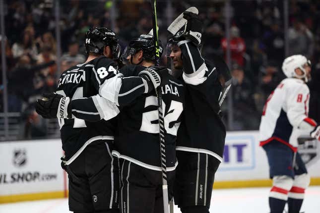 Mar 6, 2023; Los Angeles, California, USA; Los Angeles Kings defenseman Vladislav Gavrikov (84) celebrates with teammates after scoring a goal during the second period against the Washington Capitals at Crypto.com Arena.