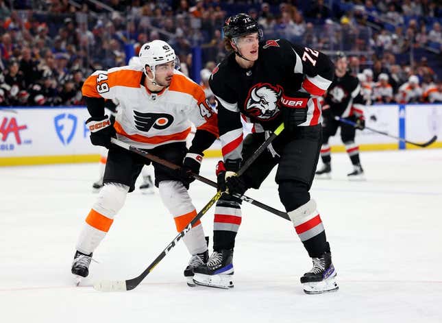 Jan 9, 2023; Buffalo, New York, USA;  Philadelphia Flyers left wing Noah Cates (49) and Buffalo Sabres center Tage Thompson (72) look for the puck during the second period at KeyBank Center.