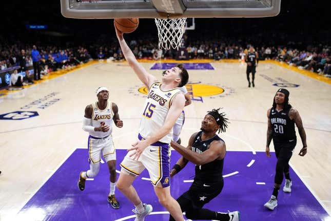 Mar 19, 2023; Los Angeles, California, USA; Los Angeles Lakers guard Austin Reaves (15) shoots against the Orlando Magic in the first half at Crypto.com Arena.
