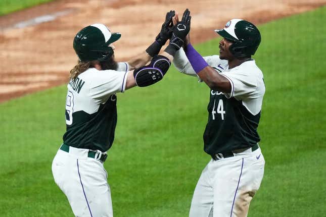Aug 19, 2023; Denver, Colorado, USA; Colorado Rockies first baseman Elehuris Montero (44) congratulates designated hitter Charlie Blackmon (19) for his two run home run in the seventh inning against the Chicago White Sox at Coors Field.