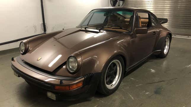 A photo of a brown Porsche 911 stolen from a museum. 