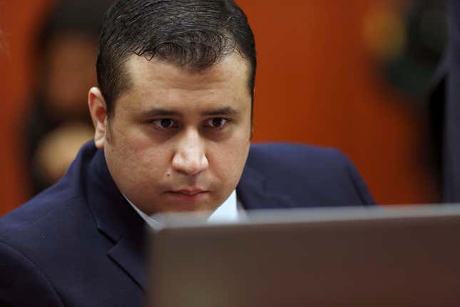 George Zimmerman looks at information on a laptop during jury selection in his trial in Seminole circuit court in Sanford, Fla., June 20, 2013. A judge in Florida has dismissed a defamation and conspiracy lawsuit former neighborhood watch volunteer George Zimmerman had filed against the parents of Trayvon Martin, the teen he fatally shot almost a decade ago in a case that drew international attention about race and gun violence.