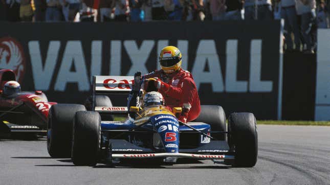 Nigel Mansell, one of our featured drivers on this list, gives Ayrton Senna a lift after the 1991 British Grand Prix.