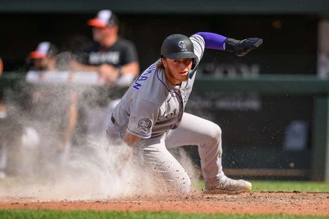 Aug 27, 2023; Baltimore, Maryland, USA; Colorado Rockies first baseman Hunter Goodman (15) scores a run during the ninth inning against the Baltimore Orioles at Oriole Park at Camden Yards.