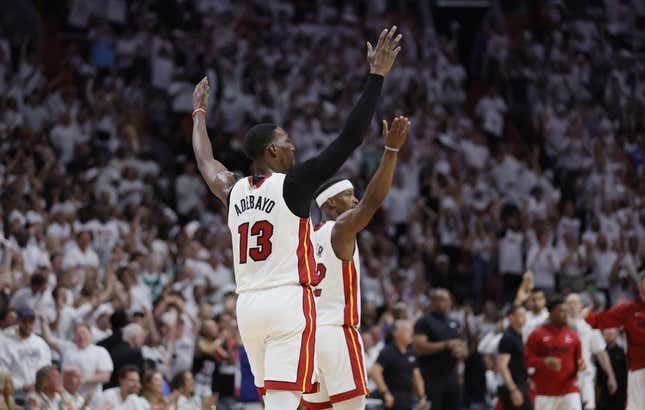 May 21, 2023; Miami, Florida, USA; Miami Heat center Bam Adebayo (13) and forward Jimmy Butler (22) react after a play during the third quarter against the Boston Celtics in game three of the Eastern Conference Finals for the 2023 NBA playoffs at Kaseya Center.