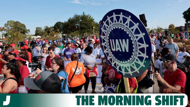 A photo of a AUW sign during a Labor Day parade. 