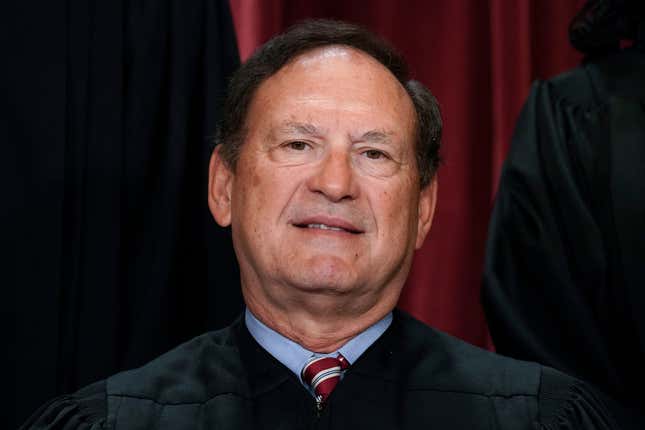 Associate Justice Samuel Alito joins other members of the Supreme Court as they pose for a new group portrait, at the Supreme Court building in Washington, Oct. 7, 2022. 