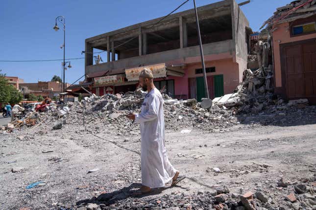 A man walks near the rubble of buildings after the earthquake, in the town of Amizmiz, near Marrakech, Morocco, Sunday, Sept. 10, 2023. An aftershock rattled Moroccans on Sunday as they prayed for victims of the nation’s strongest earthquake in more than a century and toiled to rescue survivors while soldiers and workers brought water and supplies to desperate mountain villages in ruins. (AP Photo/Mosa&#39;ab Elshamy)