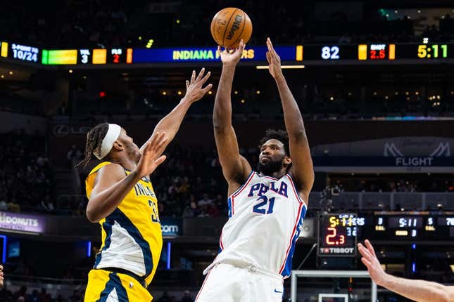 Mar 18, 2023; Indianapolis, Indiana, USA; Philadelphia 76ers center Joel Embiid (21) shoots the ball while Indiana Pacers center Myles Turner (33) defends in the second half at Gainbridge Fieldhouse.