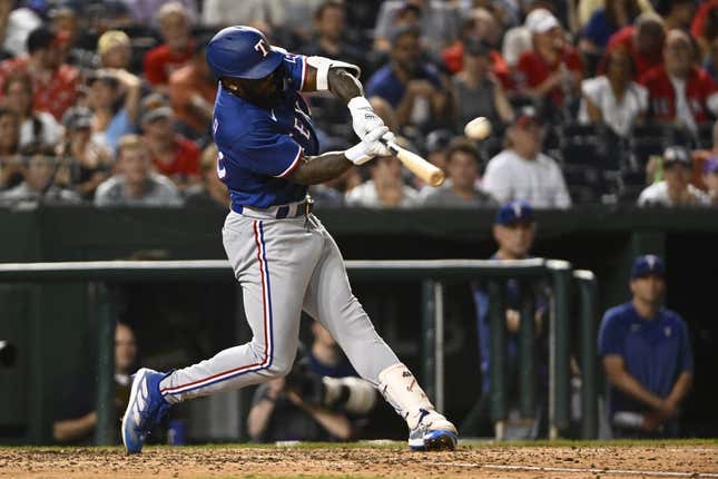 Jul 7, 2023; Washington, District of Columbia, USA; Texas Rangers right fielder Adolis Garcia (53) hits a solo home run against the Washington Nationals during the seventh inning at Nationals Park.