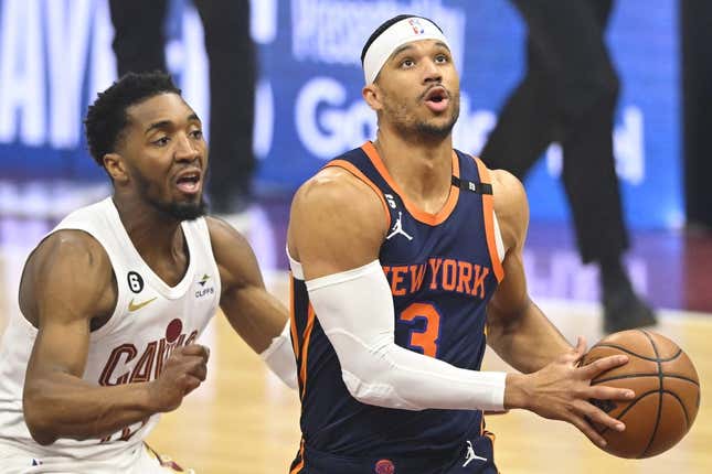 Apr 26, 2023; Cleveland, Ohio, USA; New York Knicks guard Josh Hart (3) drives beside Cleveland Cavaliers guard Donovan Mitchell (45) in the first quarter during game five of the 2023 NBA playoffs at Rocket Mortgage FieldHouse.