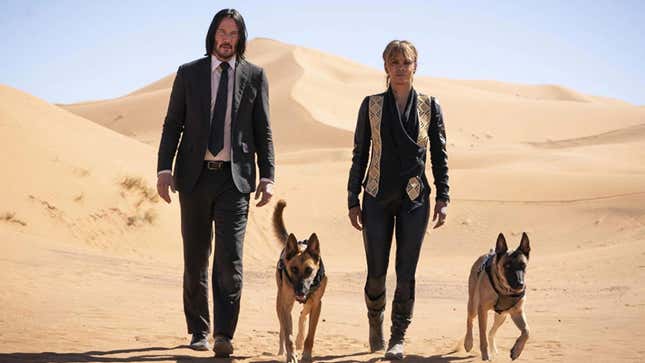 the characters walking in the desert with dogs