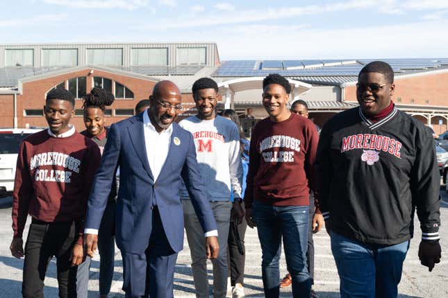 ATLANTA, GA - OCTOBER 17: Senator Raphael Warnock (D-GA) speaks with students from Morehouse College after casting his ballot on the first day of early voting on October 17, 2022 in Atlanta, Georgia. The Democratic incumbent, Warnock is running against Republican candidate Herschel Walker for the Senate seat in Georgia.