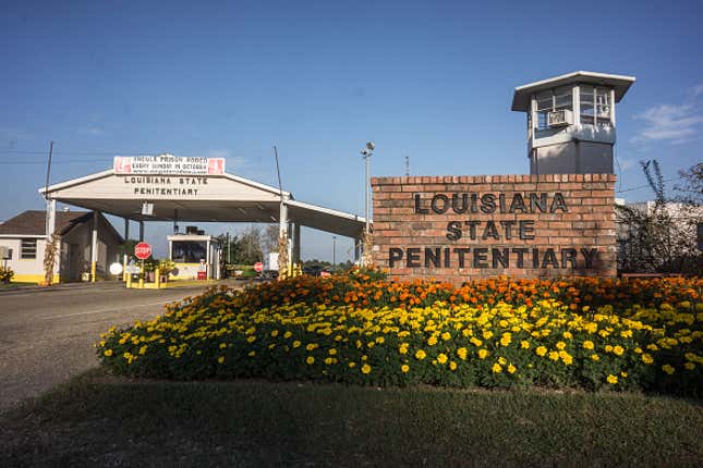 The entrance of Angola Prison, Louisiana. The Louisiana State Penitentiary, also known as Angola, and nicknamed the “Alcatraz of the South” and “The Farm” is a maximum-security prison farm in Louisiana operated by the Louisiana Department of Public Safety &amp; Corrections. It is named Angola after the former plantation that occupied this territory, which was named for the African country that was the origin of many enslaved Africans brought to Louisiana in slavery times. Angola Prison is the largest maximum-security prison in the United States[with 6,300 prisoners and 1,800 staff, including corrections officers, janitors, maintenance, and wardens. It is located on an 18,000-acre (7,300 ha) property that was previously known as the Angola Plantations and bordered on three sides by the Mississippi River. 