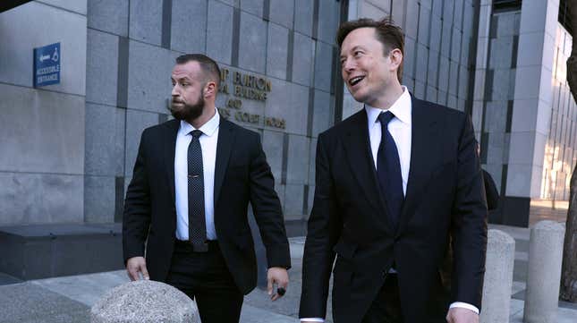 Twitter and Tesla CEO Elon Musk (R) leaves the Phillip Burton Federal Building on January 24, 2023 in San Francisco, California. Musk testified at a trial regarding a lawsuit that has investors suing Tesla and Musk over his August 2018 tweets saying he was taking Tesla private with funding that he had secured.