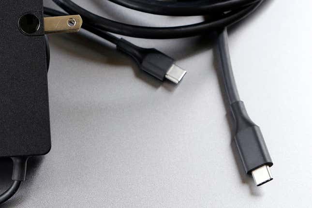 FILE - A USB-C cable is pictured in San Jose, Calif. Tuesday, March 10, 2015. Apple is ditching its in-house iPhone charging plug and falling in line with the rest of the tech industry by adopting USB-C, a more widely used connection standard. (AP Photo/Jeff Chiu, File)