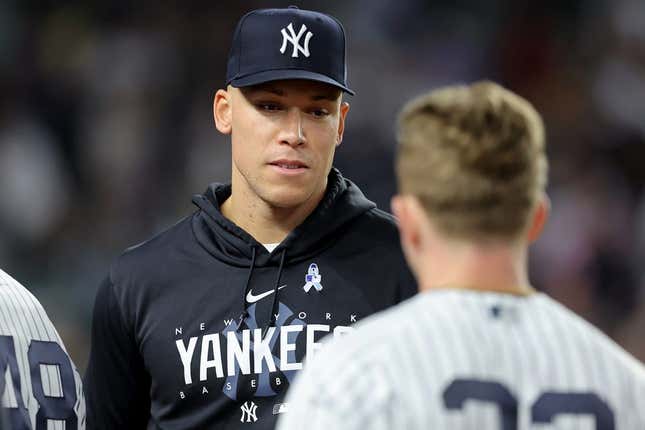 Jun 20, 2023; Bronx, New York, USA; New York Yankees injured outfielder Aaron Judge (99) talks to center fielder Harrison Bader (22) during the seventh inning against the Seattle Mariners at Yankee Stadium.