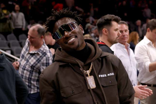 Mar 11, 2022; Atlanta, Georgia, USA; Former Tampa Bay Buccaneers wide receiver Antonio Brown poses for photographers after the game between the Atlanta Hawks and the LA Clippers at State Farm Arena.