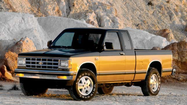A photo of a black and yellow Chevrolet S-10 pickup truck. 