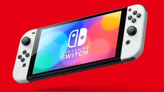 A Switch OLED hangs in front of a red background. 