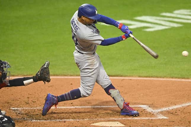 Aug 23, 2023; Cleveland, Ohio, USA; Los Angeles Dodgers right fielder Mookie Betts (50) singles in the second inning against the Cleveland Guardians at Progressive Field.