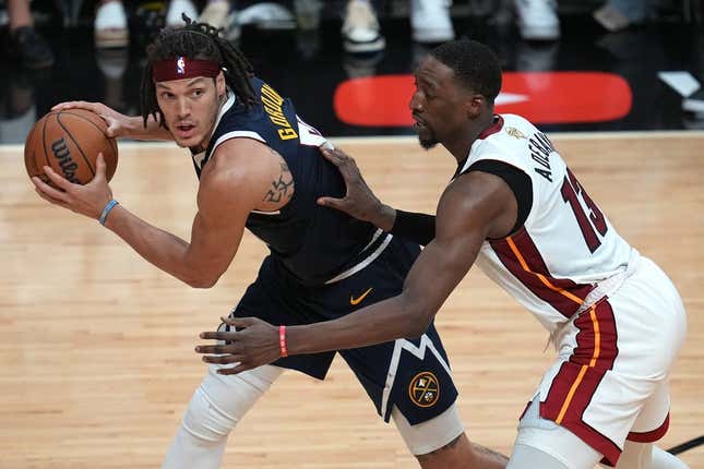 Jun 9, 2023; Miami, Florida, USA; Denver Nuggets forward Aaron Gordon (50) controls the ball while defended by Miami Heat center Bam Adebayo (13) during the second half in game four of the 2023 NBA Finals at Kaseya Center.