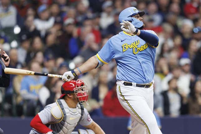 Apr 7, 2023; Milwaukee, Wisconsin, USA;  Milwaukee Brewers first baseman Rowdy Tellez (11) drives in a run with a sacrifice fly ball during the third inning against the St. Louis Cardinals at American Family Field.