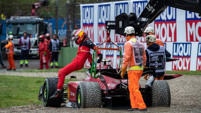A photo of Carlos Sainz stuck in a gravel trap.