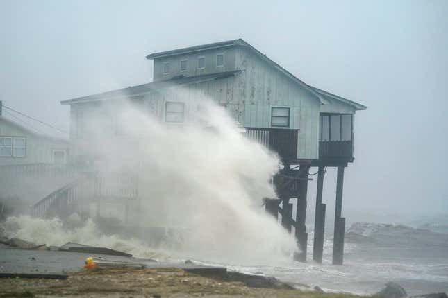 Waves take over a house as Hurricane Michael comes ashore in Alligator Point.