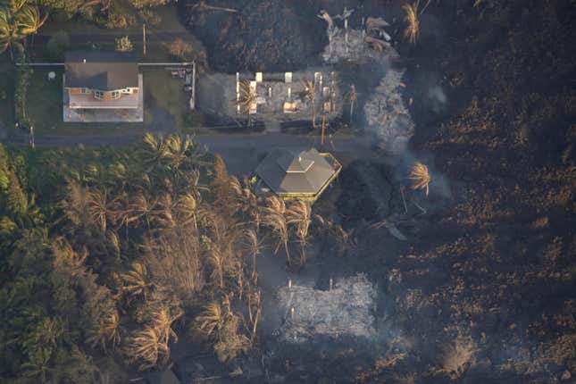 Image for article titled New aerial photos show Kilauea’s lava devouring neighborhoods