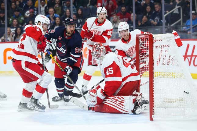 Mar 31, 2023; Winnipeg, Manitoba, CAN;  Winnipeg Jets forward Nino Niederreiter (62) scores on Detroit Red Wings goalie Magnus Hellberg (45) during the second period at Canada Life Centre.