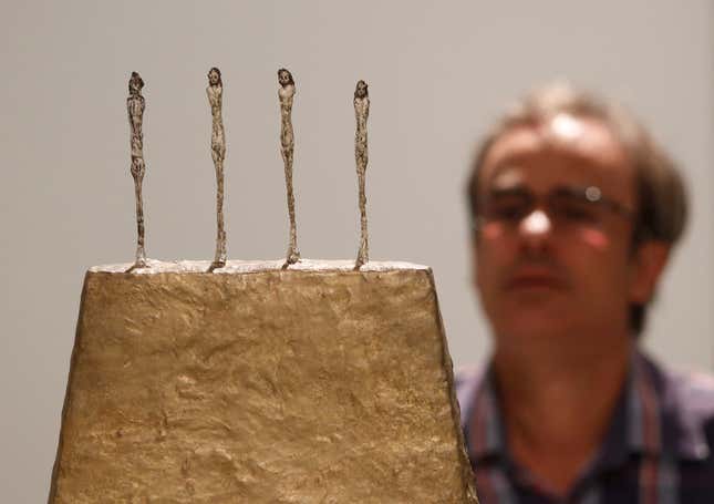 The sculpture "Four Figures on a Base" by Alberto Giacometti.