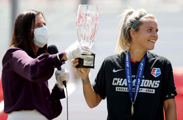 NWSL Commissioner Lisa Baird, left, seen presenting trophy to Rachel Daly in 2020, is out after a sexual misconduct report came out about one of the league’s coaches.