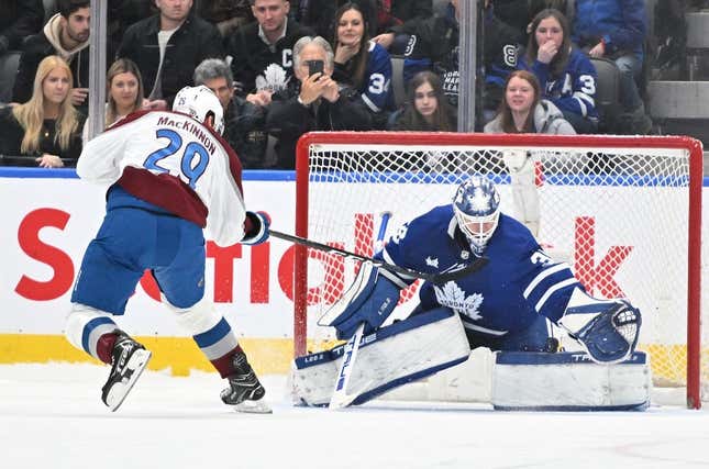 Mar 15, 2023; Toronto, Ontario, CAN;   Colorado Avalanche forward Nathan MacKinnon (29) scores the winning goal past Toronto Maple Leafs goalie Ilya Samsonov (35) in the overtime shootout at Scotiabank Arena.