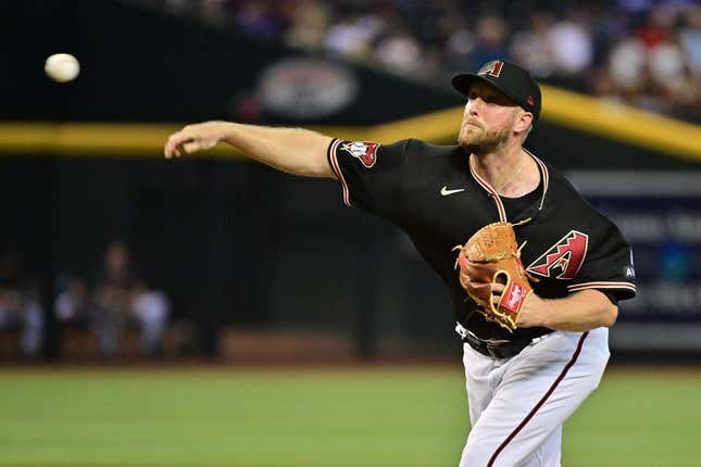 Aug 9, 2023; Phoenix, Arizona, USA;  Arizona Diamondbacks starting pitcher Merrill Kelly (29) throws in the first inning against the Los Angeles Dodgers at Chase Field.