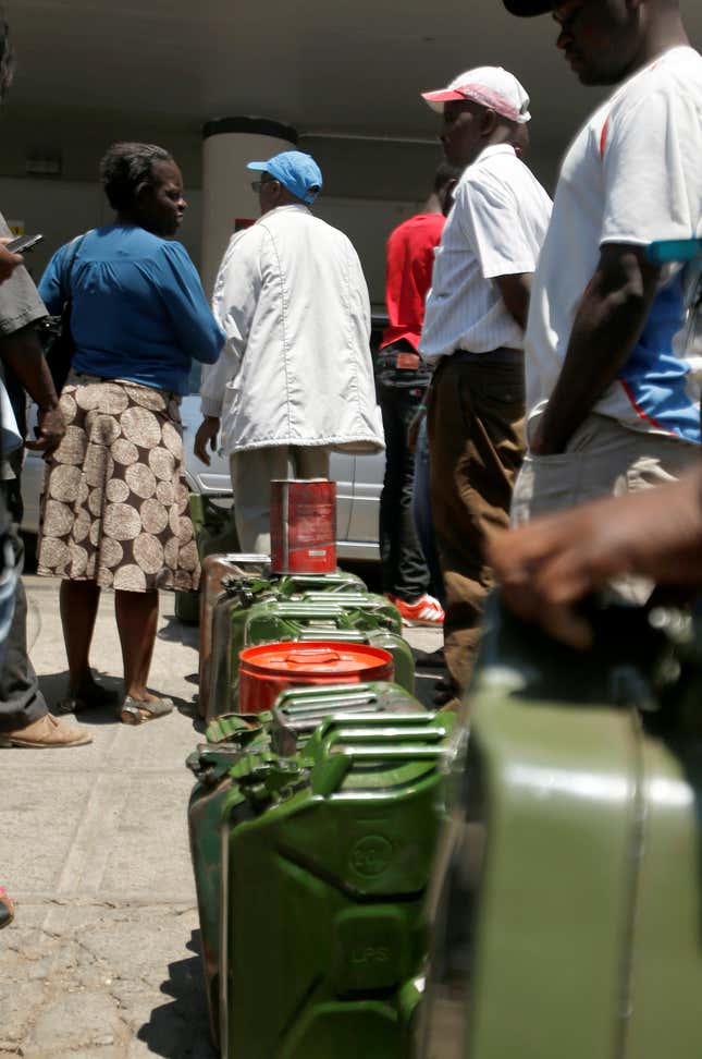 Motorists queue to buy petrol in Harare, Zimbabwe