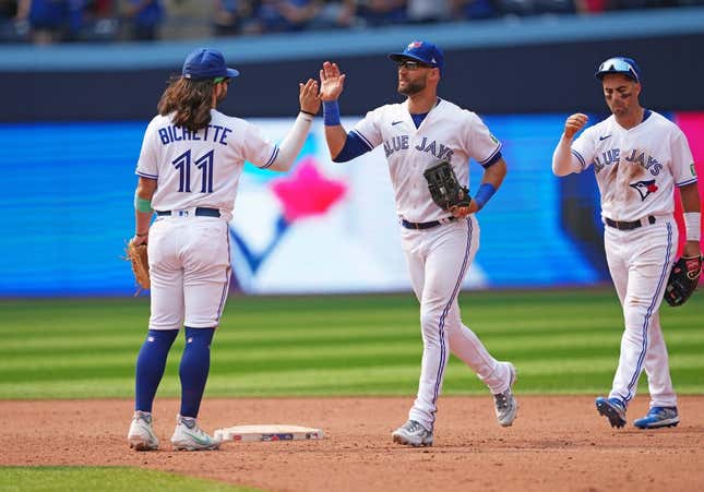 Jul 16, 2023; Toronto, Ontario, CAN; Toronto Blue Jays shortstop Bo Bichette (11) and center fielder Kevin Kiermaier (39) celebrate the win at the end of the ninth inning against the Arizona Diamondbacks at Rogers Centre.