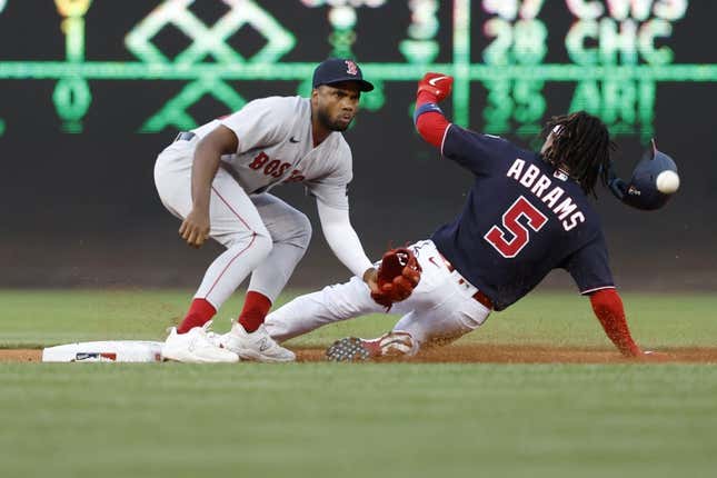 Aug 15, 2023; Washington, District of Columbia, USA; Washington Nationals shortstop CJ Abrams (5) steals second base ahead of a tag by Boston Red Sox shortstop Pablo Reyes (19) during the first inning at Nationals Park.