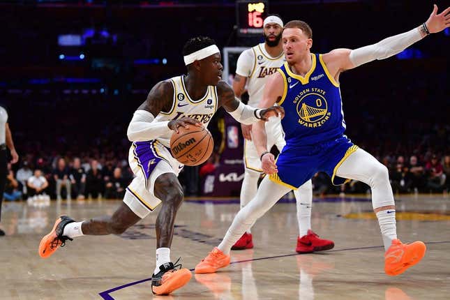 May 6, 2023; Los Angeles, California, USA; Los Angeles Lakers guard Dennis Schroder (17) moves the ball against Golden State Warriors guard Donte DiVincenzo (0) during the first half in game three of the 2023 NBA playoffs at Crypto.com Arena.