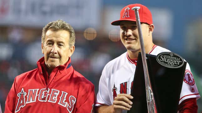 Los Angeles Angels owner Arte Moreno, left, stands with outfielder Mike Trout after presenting Trout with a Silver Slugger Award prior to a baseball game against the Texas Rangers, Friday, April 8, 2016, in Anaheim, Calif. 